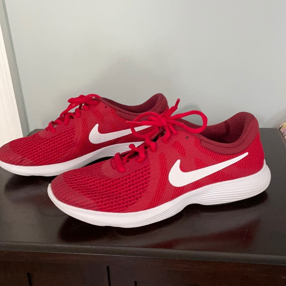 Nike size 7 youth red athletic shoes.